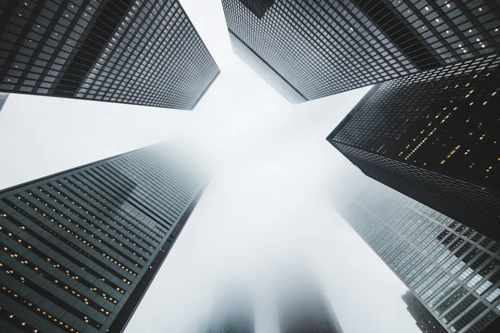 Office towers seen from street level, looking up.