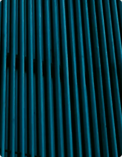 Rows of vertical metal tubes fill the frame.