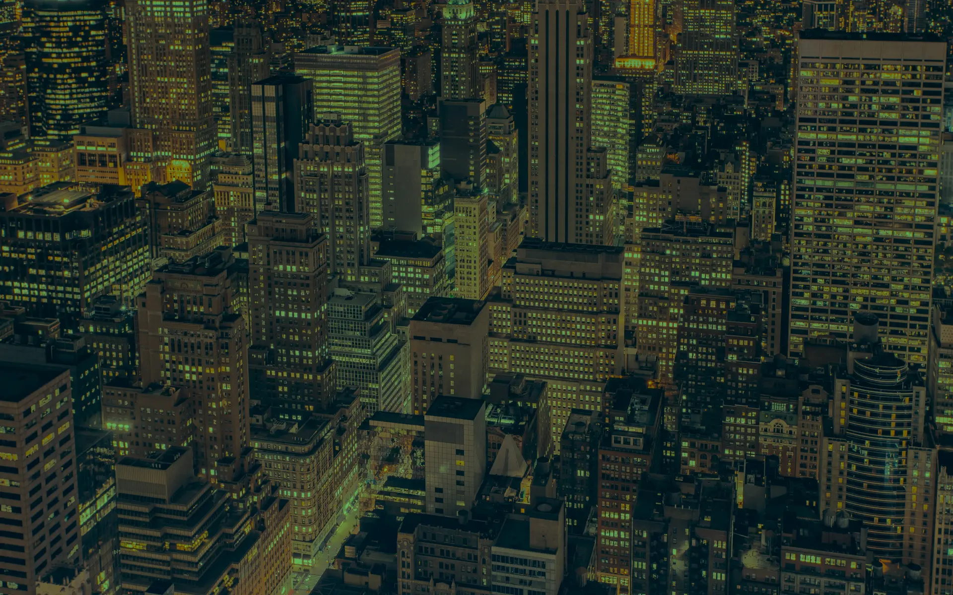 A city at night from the air, in black and white.
