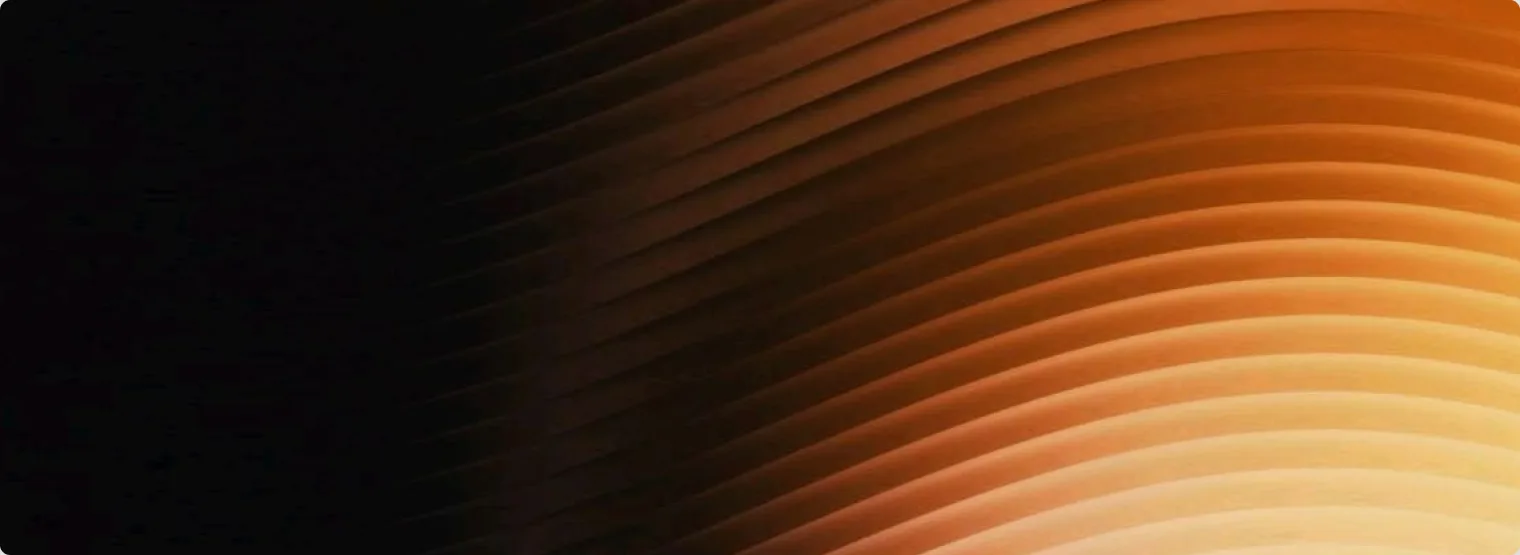 Fanned orange light over a dark ground.
