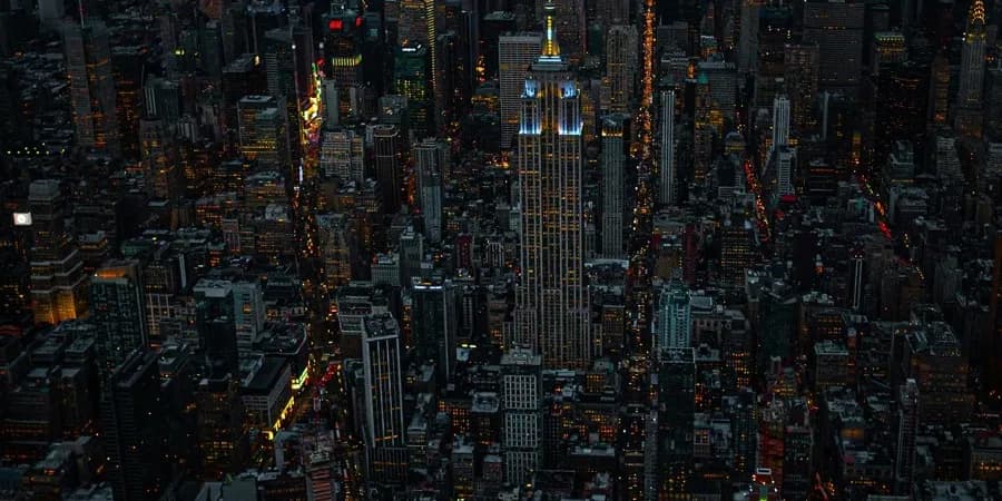 A dense city grid seen from above at night.