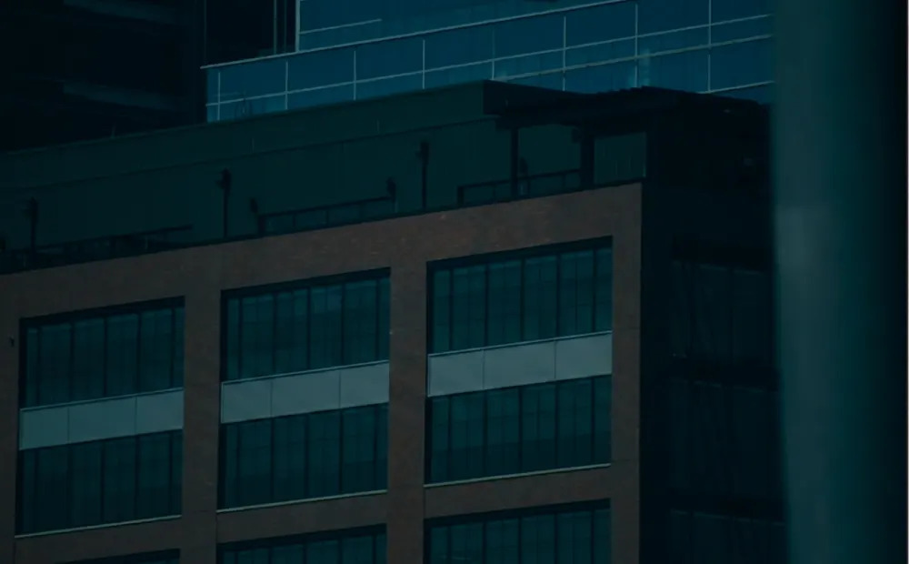 The upper floors of an office block at night.