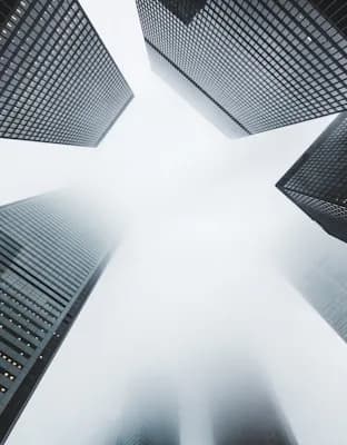 Office towers seen from street level, looking up.