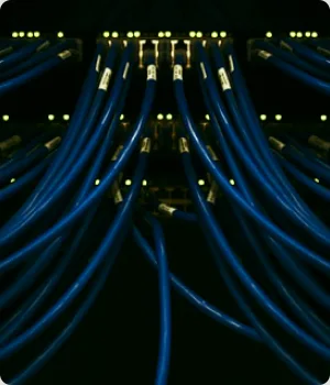 Bundles of network cables run down a rack.